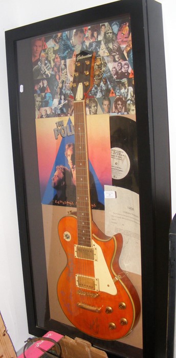 A six string guitar signed by The Police - with Ce