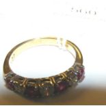 A 9ct gold ruby and diamond eternity ring