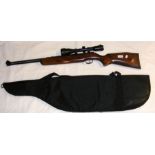 A German air rifle with scope and carrying bag