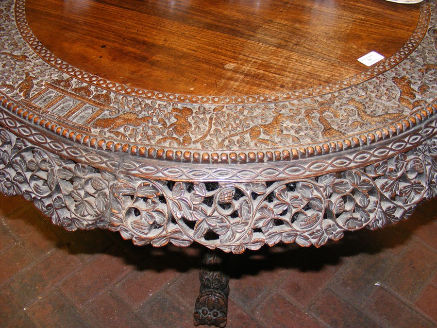 A heavily carved Anglo Indian tilt-top table with - Image 2 of 14