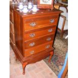 A four drawer mahogany chest on stand