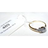 An 18ct gold three stone diamond ring