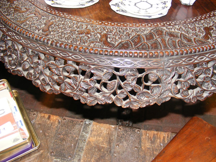 A heavily carved Anglo Indian tilt-top table with - Image 6 of 14