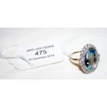A large topaz and diamond ring in 9ct gold setting