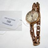 A lady's gold wrist watch and strap