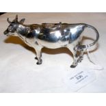 A silver cow creamer - 14cm long