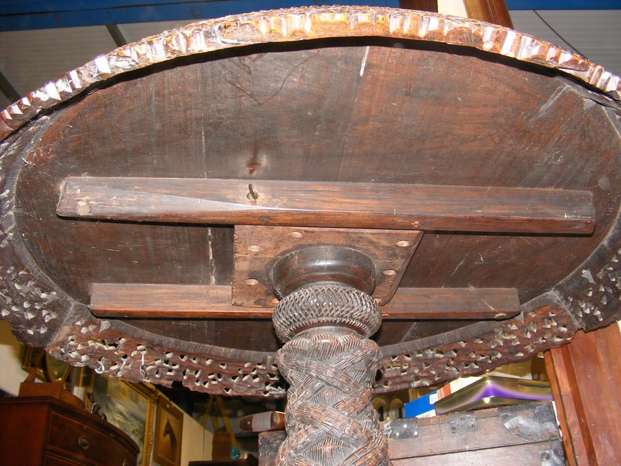 A heavily carved Anglo Indian tilt-top table with - Image 13 of 14