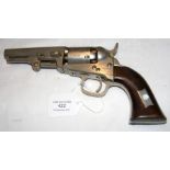 An old Colts revolver with wooden grip - Serial No