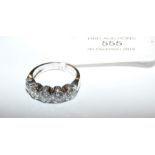 An 18ct white gold five stone diamond dress ring -