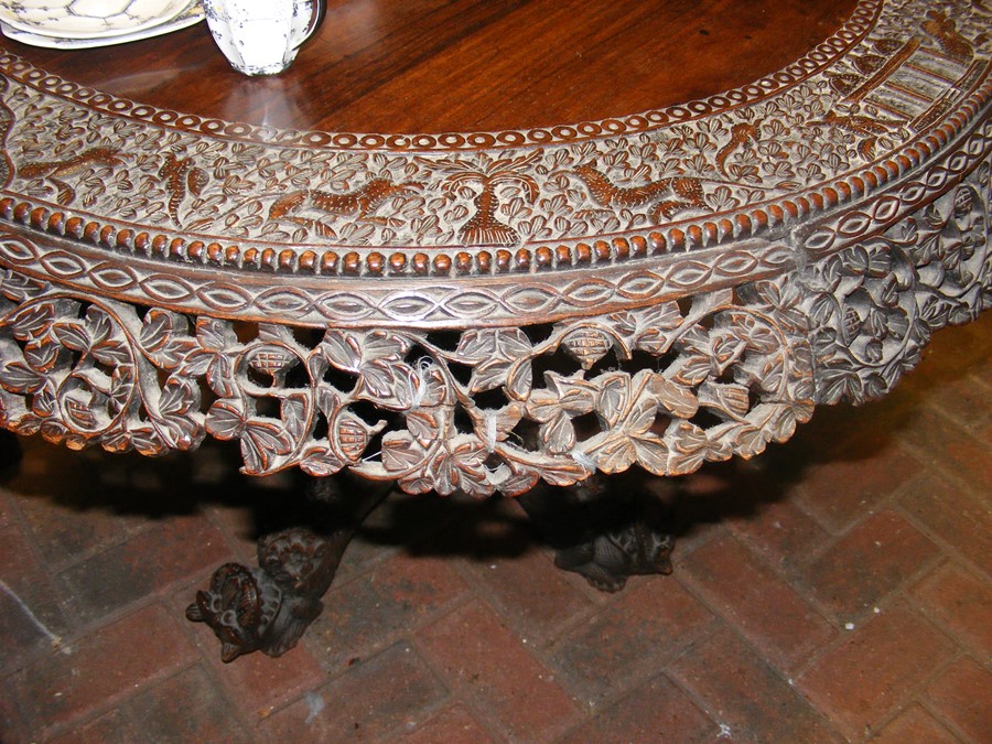 A heavily carved Anglo Indian tilt-top table with - Image 5 of 14