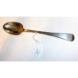 A large silver basting spoon with London hallmark