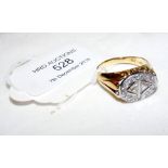 A diamond mounted oval ring in 18ct gold setting