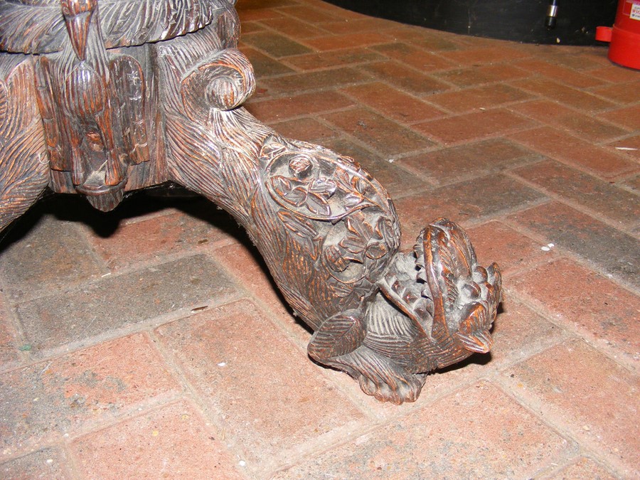 A heavily carved Anglo Indian tilt-top table with - Image 7 of 14