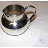 A silver jug - 8cm high