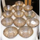 A set of twelve oriental silver pierced bowls with