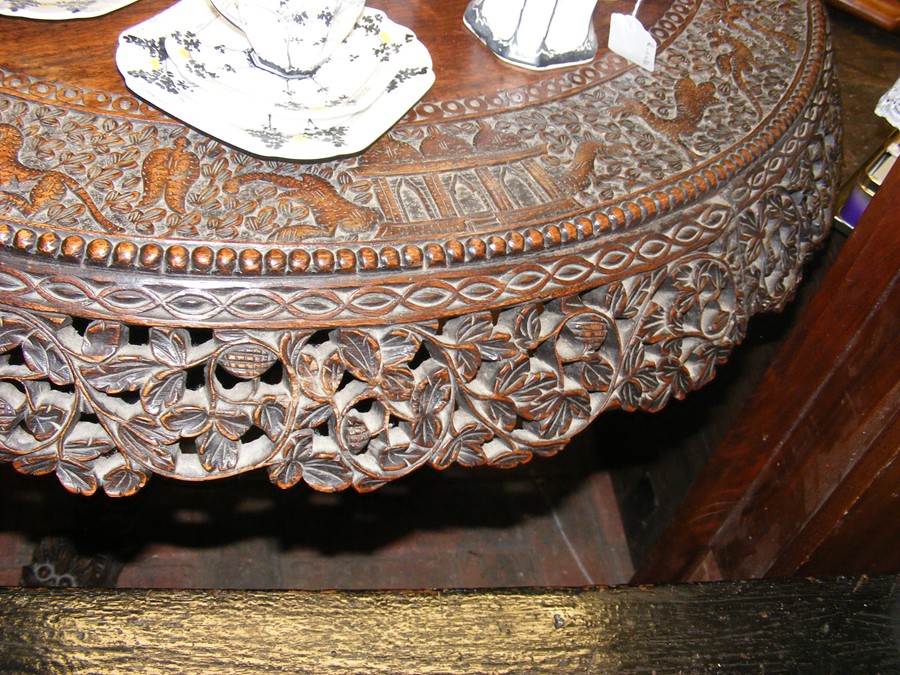 A heavily carved Anglo Indian tilt-top table with - Image 4 of 14