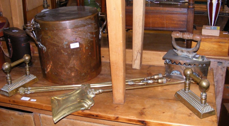 Old copper pot with lid, together with old fire ir