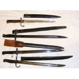 Four old bayonets with scabbards