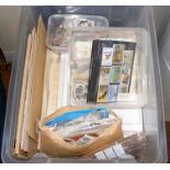 Selection of loose stamps in a plastic container