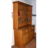 A pine dresser with plate rack over - 150cm