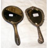 A decorative silver dressing table mirror and one