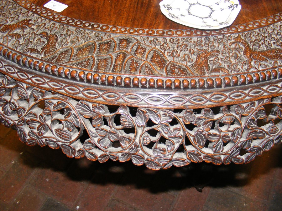 A heavily carved Anglo Indian tilt-top table with - Image 3 of 14