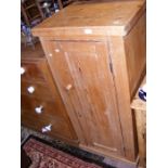 A small pine antique cupboard