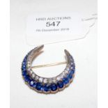 A sapphire and diamond crescent brooch in gold set
