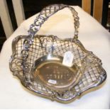 A sterling silver pierced basket with swing handle