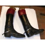 A pair of old leather riding boots with Maxwell of
