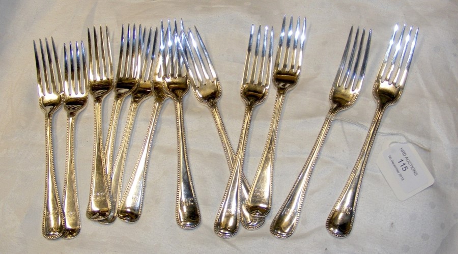 The matching set of twelve silver dessert forks -