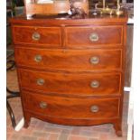 Antique bow fronted chest of drawers with cross ba