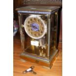 An antique French mantel clock with enamel decorat