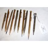 Ten silver and gold filled propelling pencils