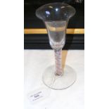 An 18th century air twist wine glass with red and