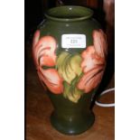 A 26cm high Moorcroft pottery vase with tube line