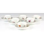 A SET OF SIX 19TH CENTURY MEISSEN CUPS AND SAUCERS decorated with painted flowers and gilt edges.