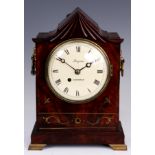 BRYSON, EDINBURGH A REGENCY FLAMED MAHOGANY AND BRASS INLAID TIMEPIECE BRACKET CLOCK with carved