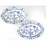 A LARGE PAIR OF MEISSEN BLUE AND WHITE OVAL SCALLOP EDGE DISHES decorated in the blue onion