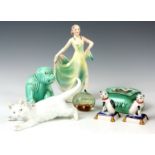 A SELECTION OF ITEMS to include a Meissen cat, a pair of continental porcelain cats sat on cushions,