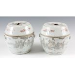 A PAIR OF 19TH CENTURY CHINESE STORAGE JARS AND COVERS with angled shaped lids and bulbous bodies,