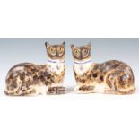 A PAIR OF LATE 19th CENTURY STAFFORDSHIRE POTTERY CATS with glass eyes and blue collars 21cm wide