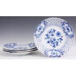 A SET OF FOUR MEISSEN BLUE AND WHITE LATTICE EDGED DESSERT PLATES decorated in the blue onion