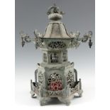 A MEIJI PERIOD JAPANESE LANTERN with pagoda top and elephant head finials above a pierced body on