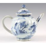 AN 18TH CENTURY BLUE AND WHITE CHINESE TEAPOT with figures in landscape settings 13cm high.