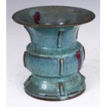 A CHINESE JUNYAO STONEWARE BALUSTER SHAPED VASE with speckled turquoise glaze and purple flecks 20cm