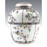 A 19TH CENTURY FAMILLE ROSE GINGER JAR of bulbous shape with lid decorated with floral panels –