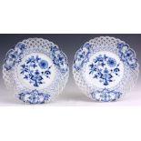 A PAIR OF MEISSEN BLUE AND WHITE LATTICE EDGED DINNER PLATES decorated in the blue onion pattern