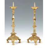 A PAIR OF 18TH CENTURY DUTCH PRICKET STICK CANDLESTICKS with dished drip trays above chamfered