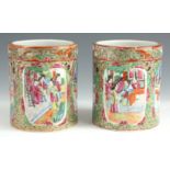 A PAIR OF 19TH CENTURY CANTON BRUSH POTS brightly painted with panelled village scenes and floral
